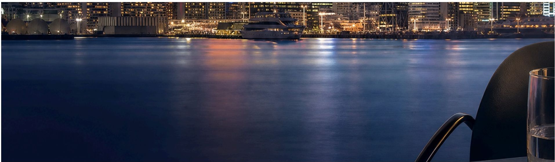 Night view of a city skyline across the water