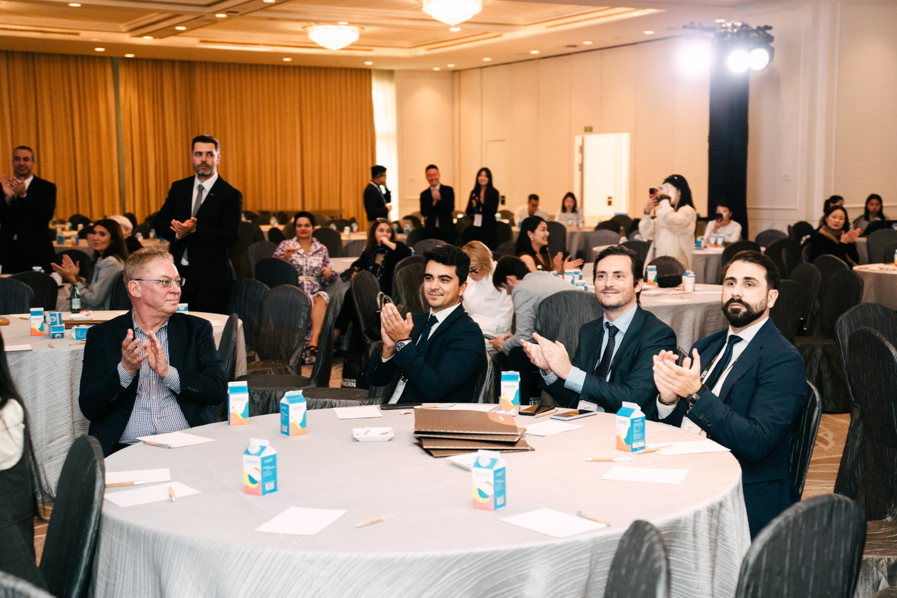 A full room of delegates follows the conference programme.